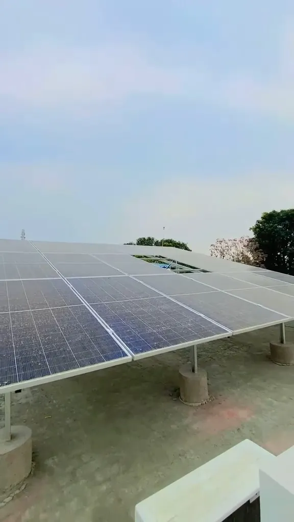 Close view along a row of solar panels showing the mounting rails underneath